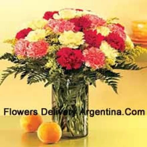 25 Mixed Colored Carnations With Seasonal Fillers In A Glass Vase
