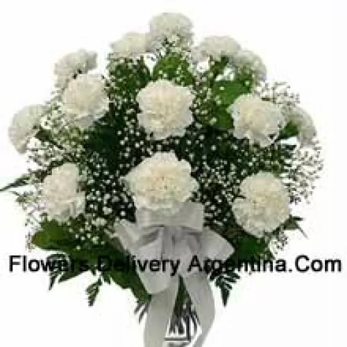 18 White Carnations With Seasonal Fillers In A Glass Vase