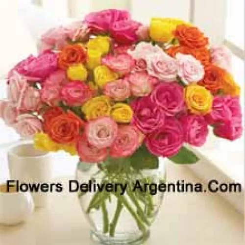 50 Mixed Colored Roses Arranged Beautifully In A Glass Vase