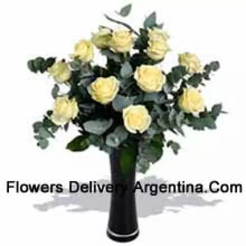 11 White Roses With Some Ferns In A Vase