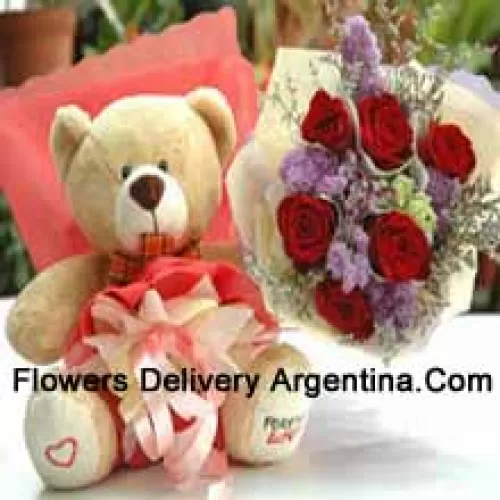 Bouquet de 7 roses rouges et un mignon ours en peluche de taille moyenne